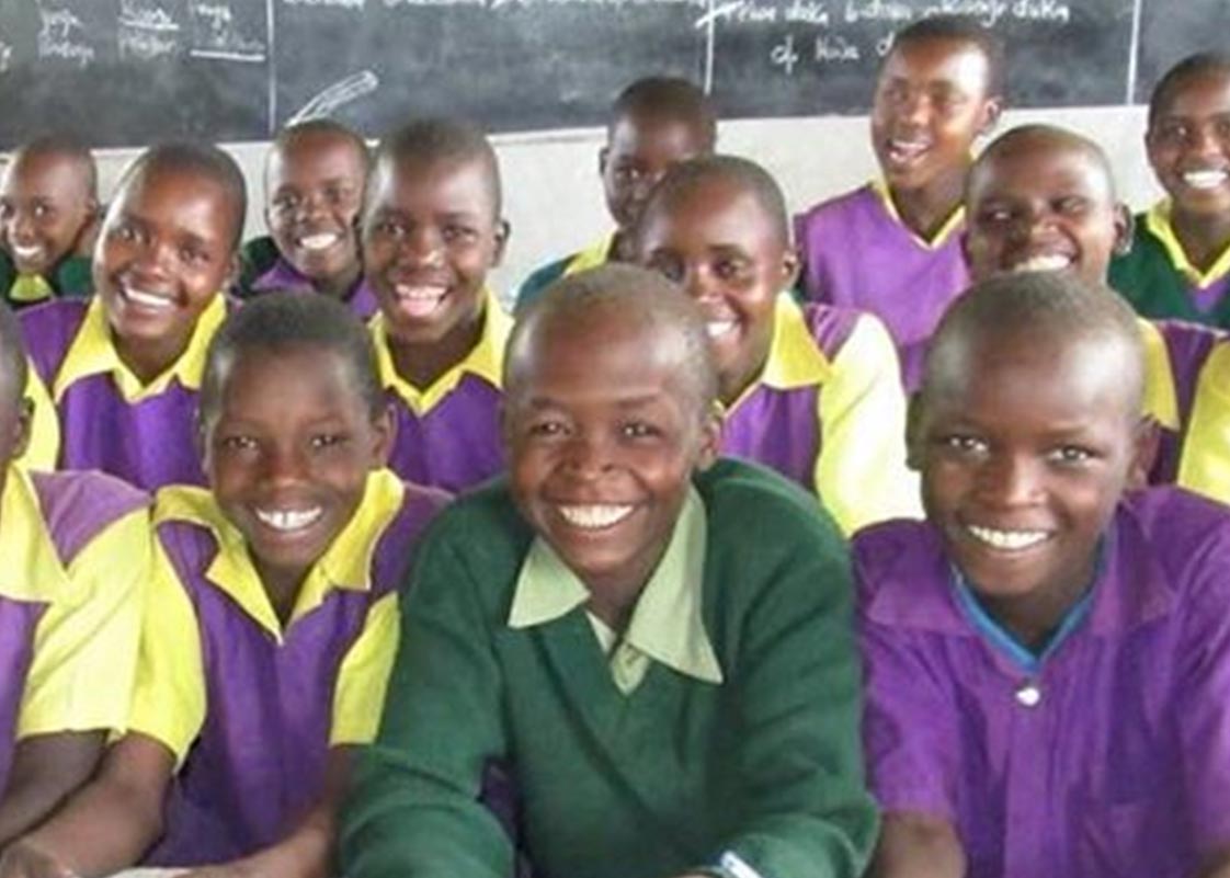 Children smiling in a classroom